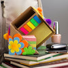 Sticky note cube holder with felt flowers decorated on outside in a girls room