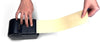 Any length sticky note with the press of a button, hands show how to press button and print a lengthy sticky note with sticky down the center of the back of the note.